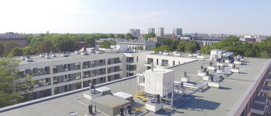 Zewnętrzny system grzewczy w apartamentowcu standardu premium